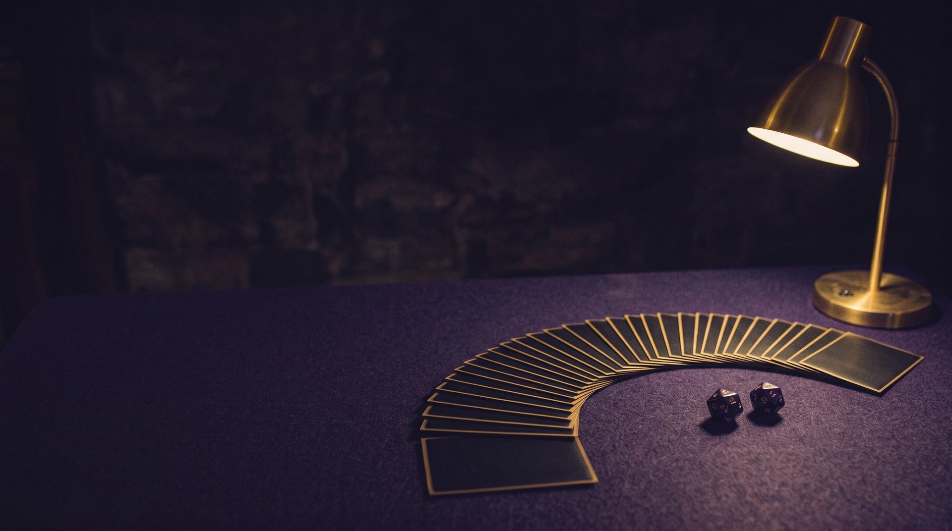 Sleeved cards fanned across the felt at GH Games, as designed